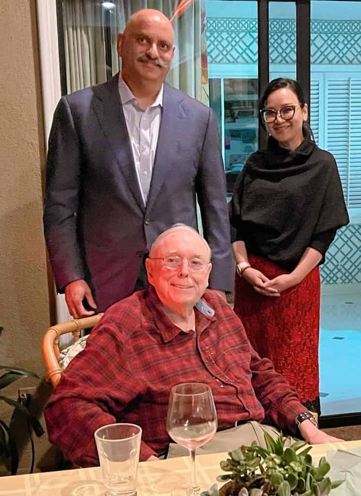mohnish pabrai with charlie munger and a woman